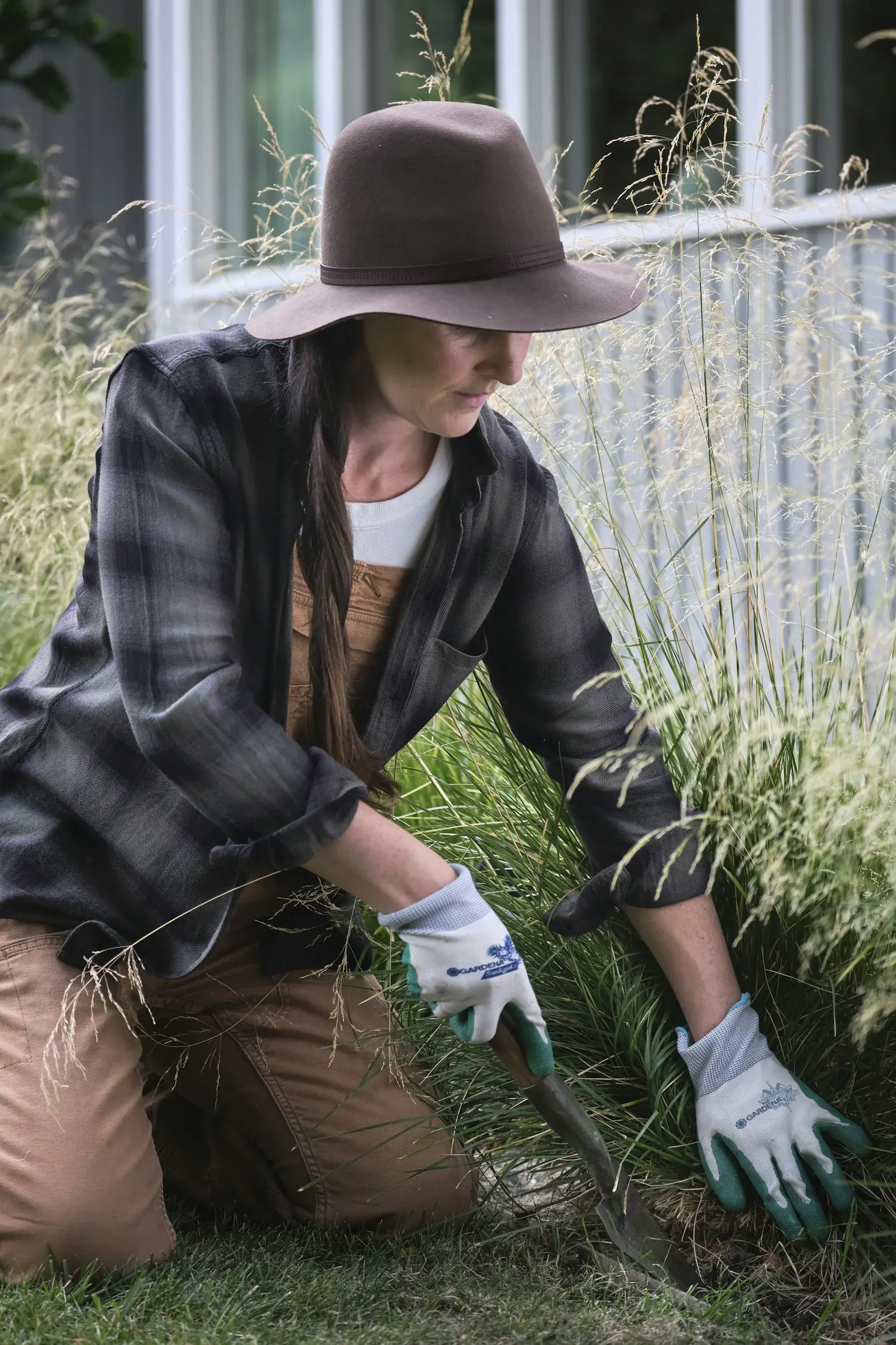 A gardener caring for a green landscape